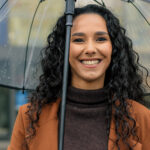 Woman smiling in the rain in Dumfries and [test_shortcode]